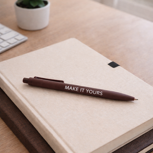 pen resting atop notebook