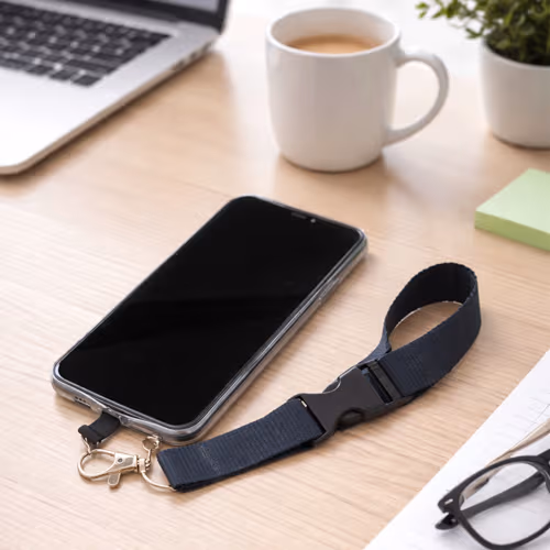 phone lanyard attached to iphone on work desk