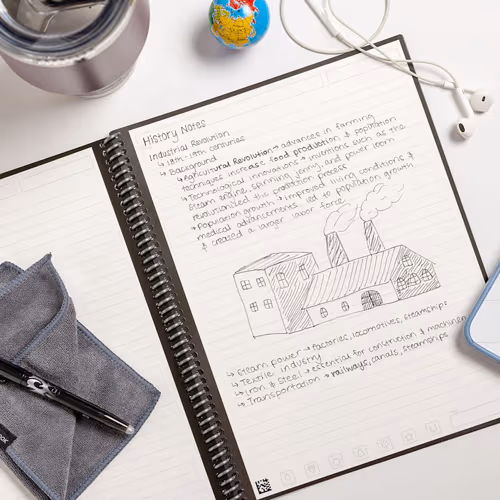 open notebook with notes and illustrations scribble on both pages beside wired headphones and pen