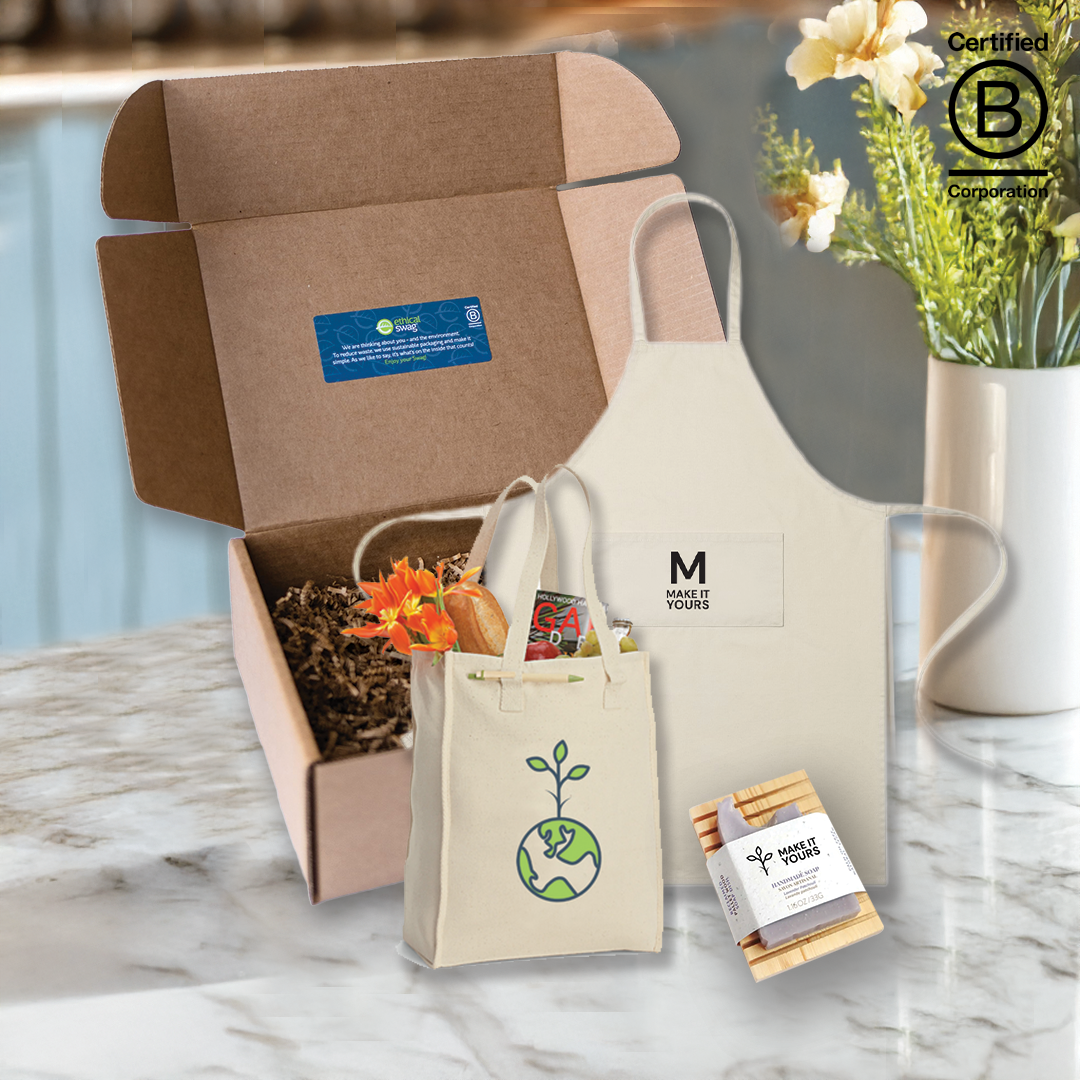 swag pack sitting on kitchen counter containing apron, tote bag, and soap within pack