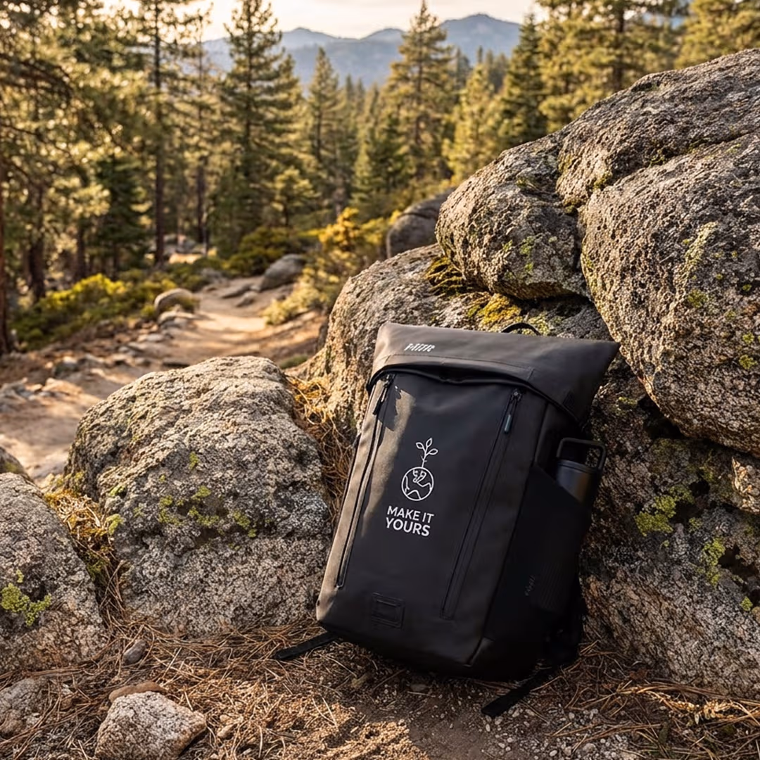 backpack leaning against rock in mountain range/hike setting