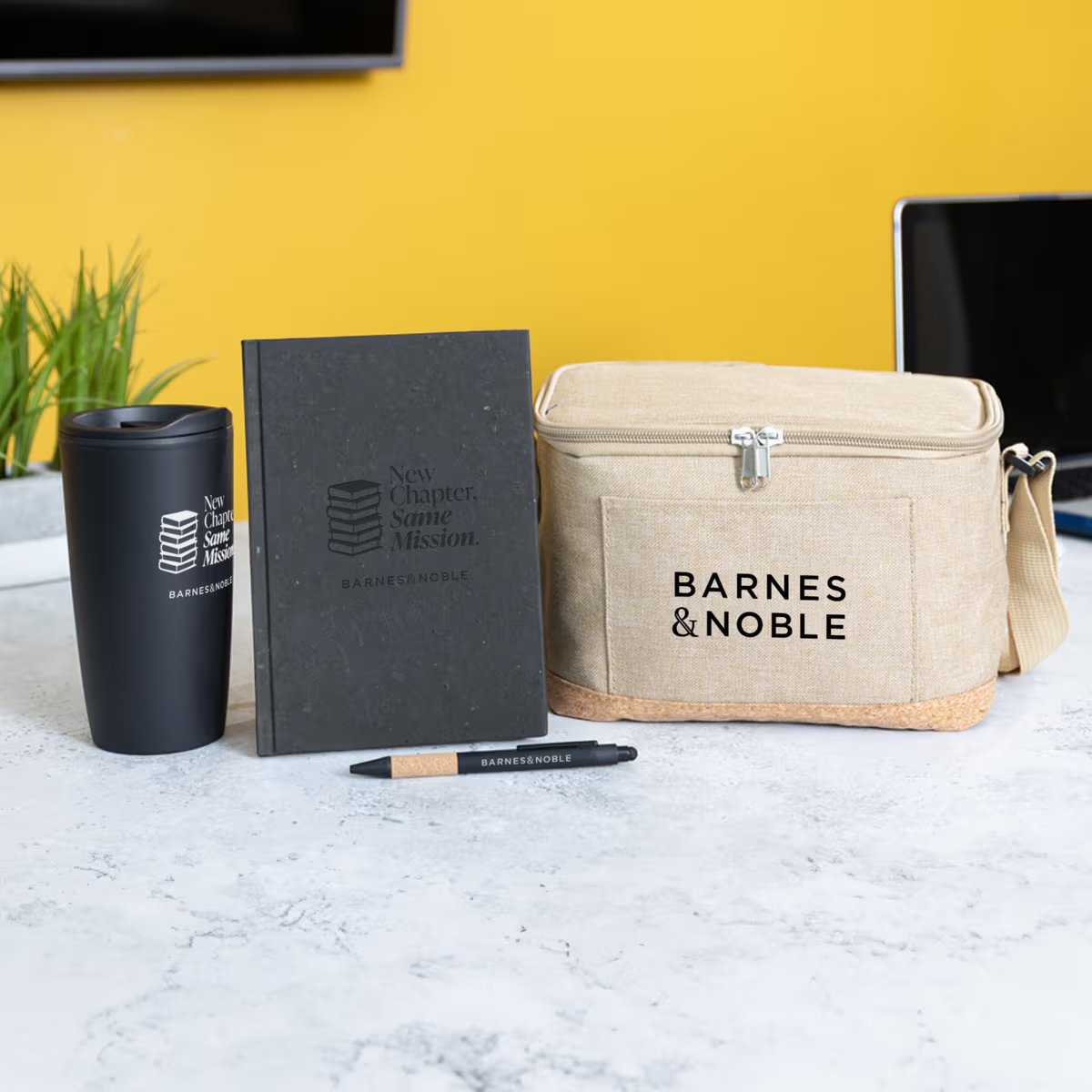 supplier curated swag pack containing branded notebook, pen with pen sleeve, cooler bag and straw tumbler