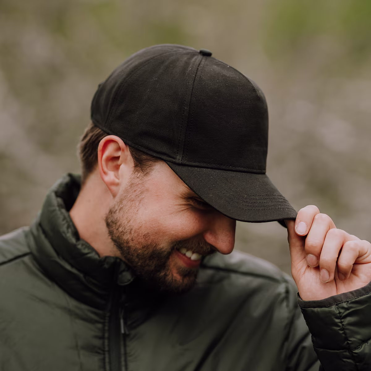 man wearing ball cap in outdoor setting